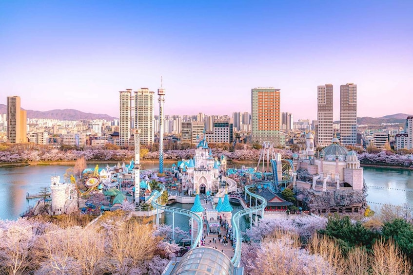 A theme park with a castle, roller coasters, and a river. 1