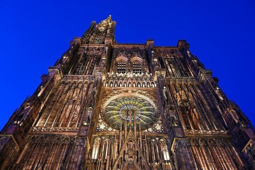 A Gothic cathedral with intricate architecture and a large circular stained glass window. 4