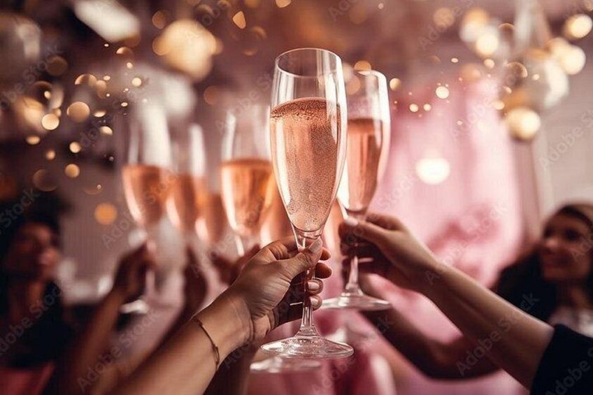 A group of people toasting with champagne glasses. 4