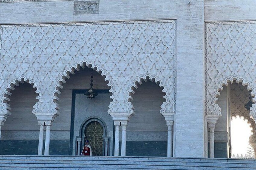 A building with intricate geometric patterns and three arched doorways. 3