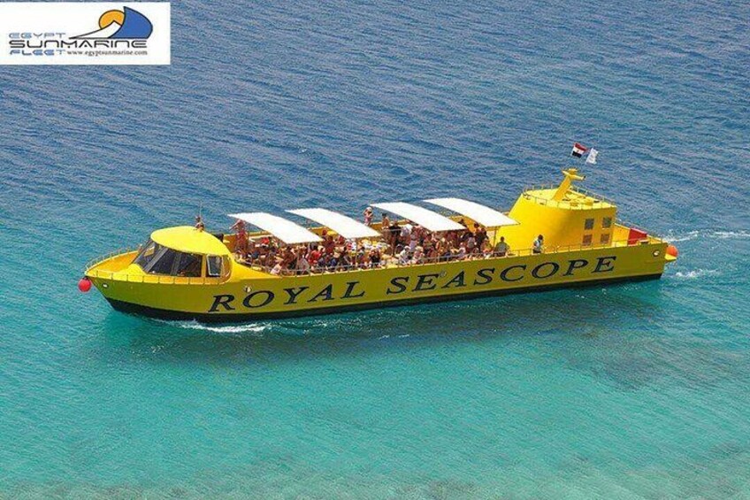 A yellow boat named 'ROYAL SEASCAPE' with passengers and a flag. 5