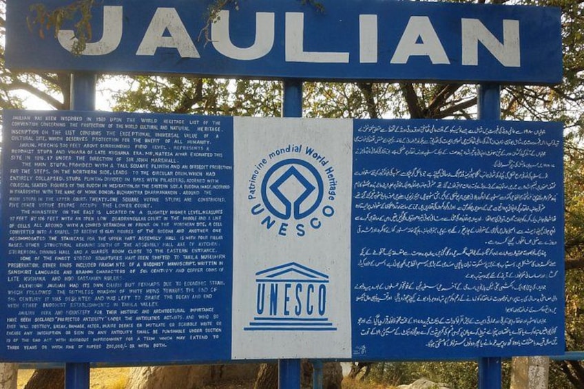 A UNESCO sign with text in multiple languages. 4