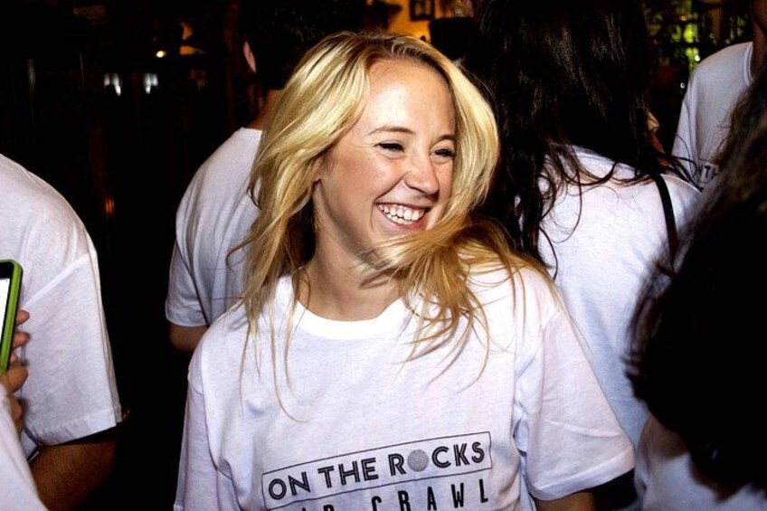 A person wearing a white t-shirt with text. 2