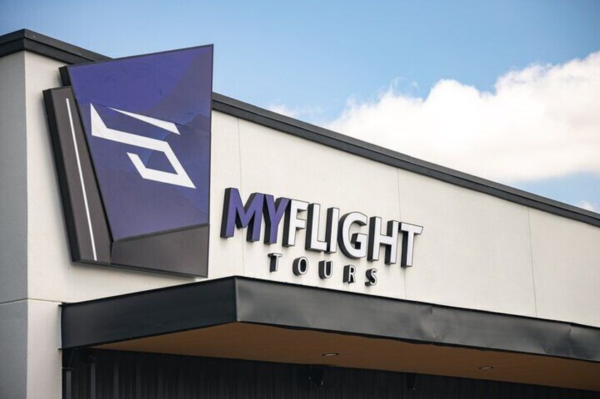 A building with a sign that reads "MYFLIGHT TOURS". 3