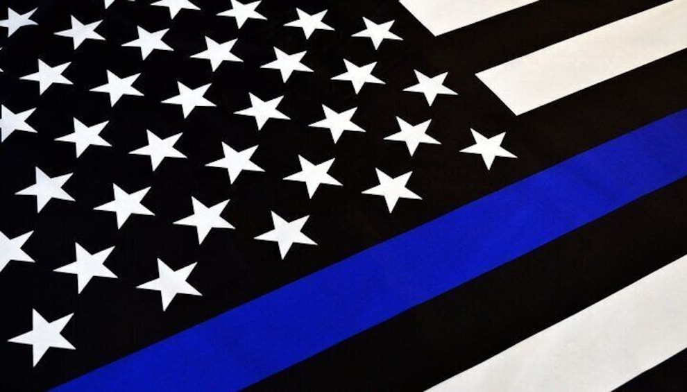 A flag with a blue stripe and white stars. 2