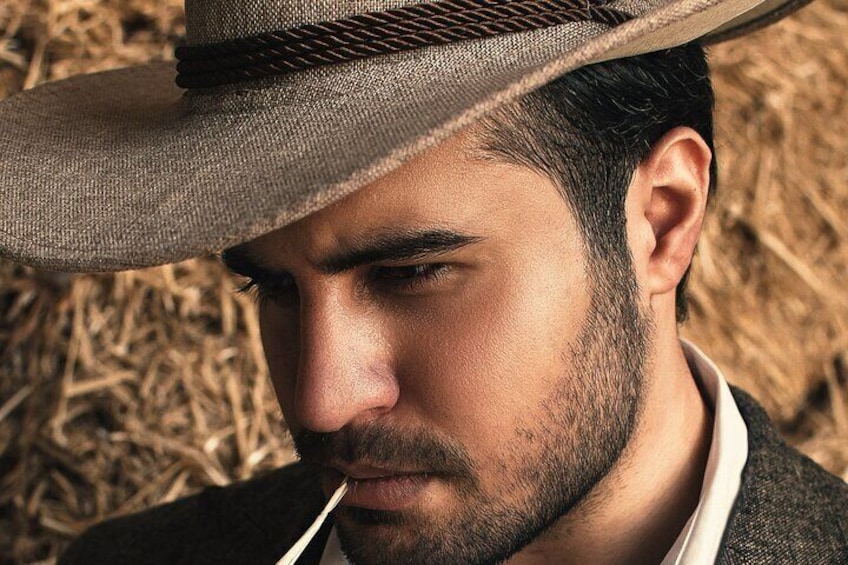 A person wearing a hat and a dark jacket. 5