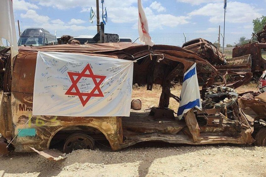 A damaged vehicle with a Star of David and Israeli flag. 3