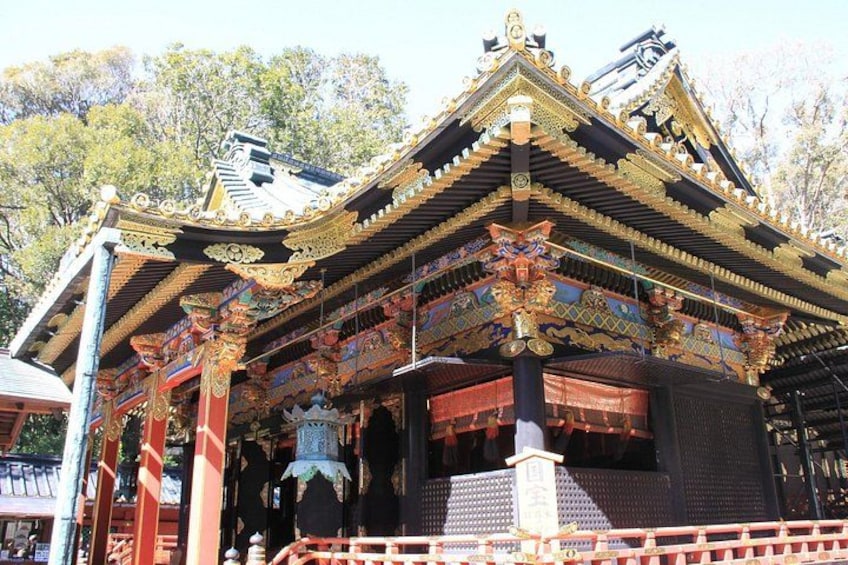 A traditional temple with ornate golden roofs and intricate decorations. 2
