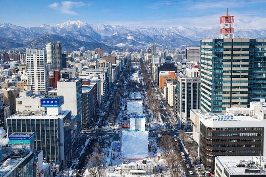 Take in Sapporo’s stunning winter cityscape framed by snowy streets and distant mountains. 2