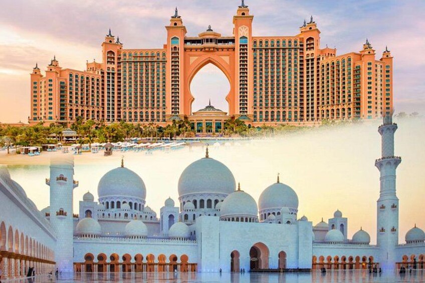 Ein großes Hotel mit einem markanten Bogen und einer Moschee mit Kuppeln im Vordergrund. 1