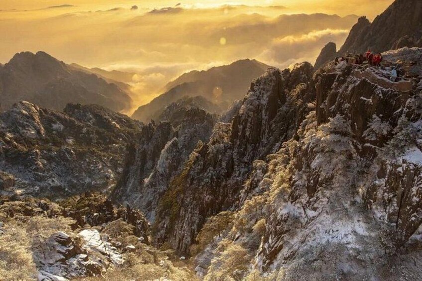 A mountainous landscape with snow-covered peaks and a valley. 4