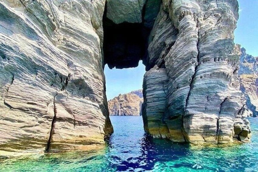 A coastal rock formation with a narrow passage. 3