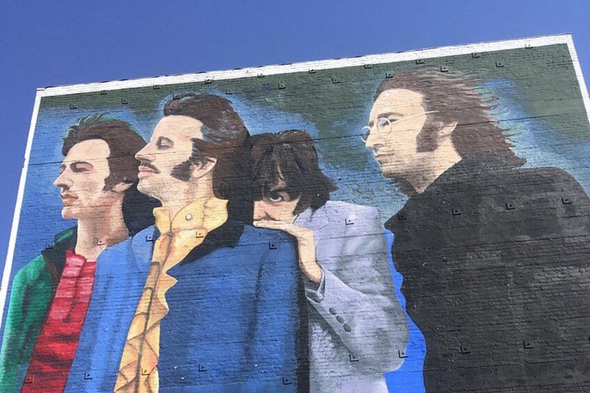 A mural of frequent Los Angeles visitors (and sometimes residents) The Beatles, painted on a building rumored to be a practice space used by Jimi Hendrix 1
