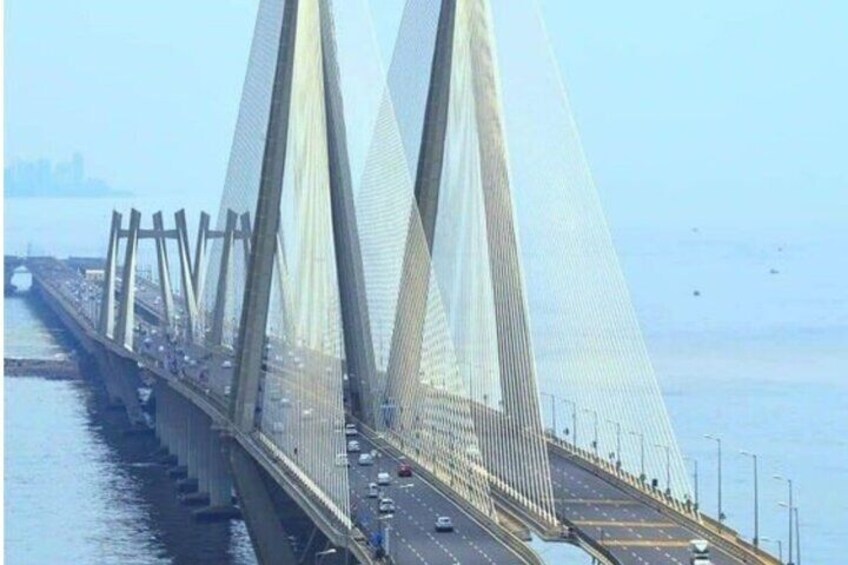 A large suspension bridge with multiple towers and cables. 4