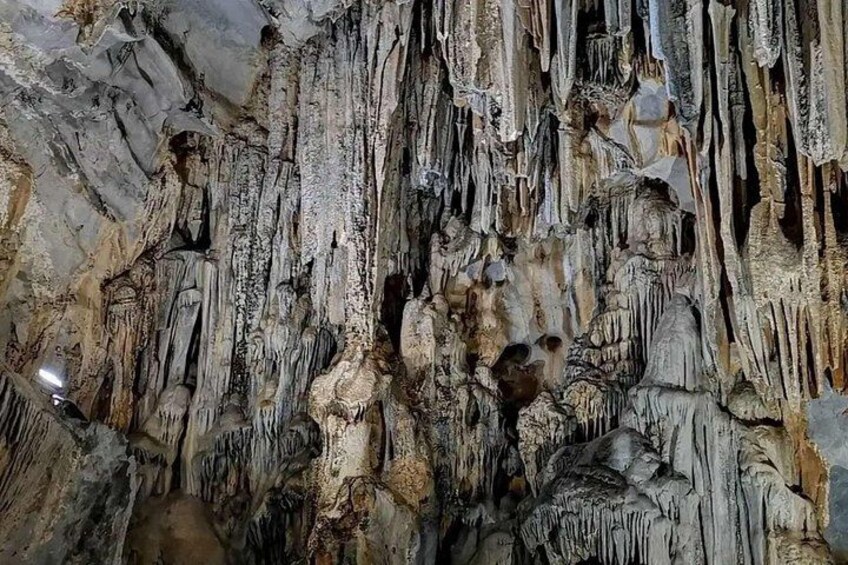 A cave with stalactites and stalagmites. 4