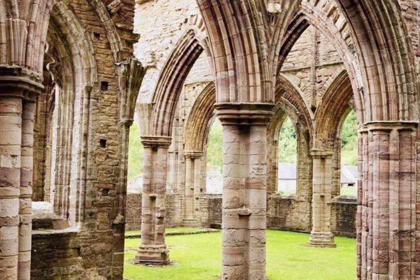 An ancient stone structure with multiple arches and columns. 3