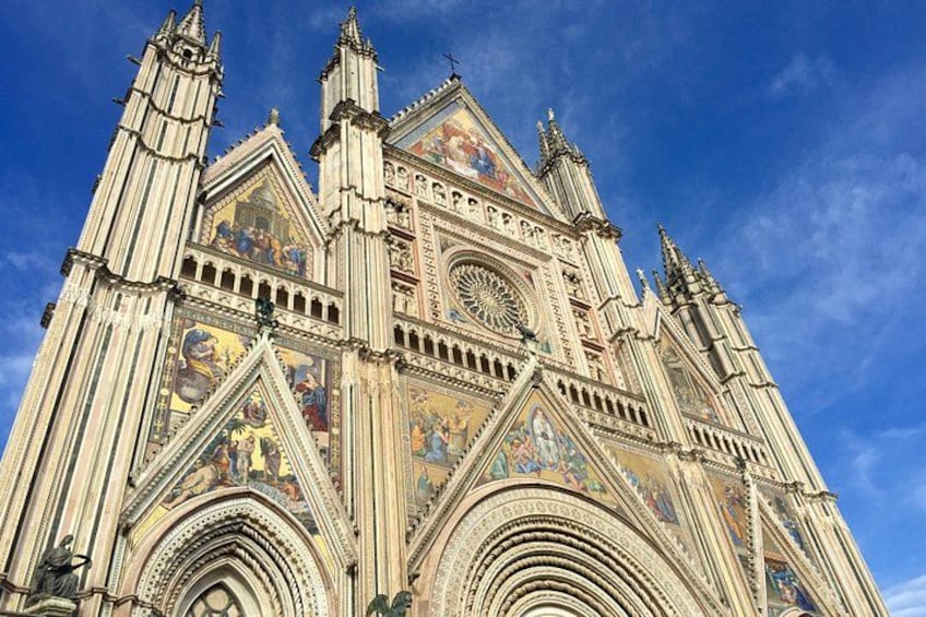 A Gothic cathedral with intricate facades, large rose windows, and detailed sculptures. 3