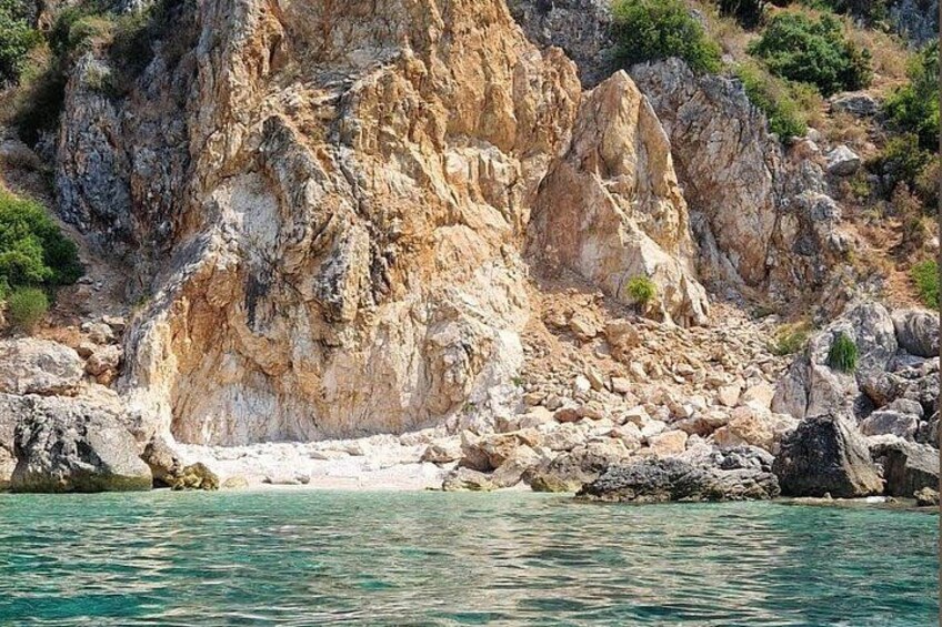 A rocky coastline with clear turquoise water. 2