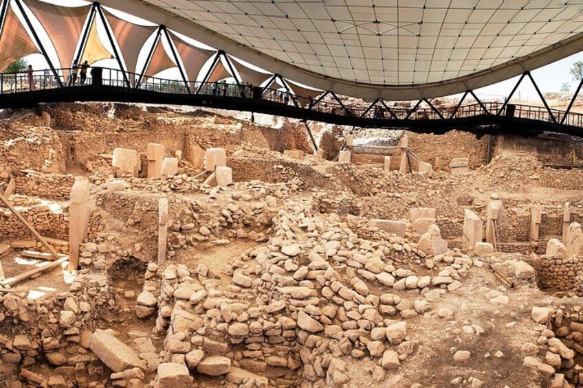 An archaeological site with exposed ruins and stone structures. 5