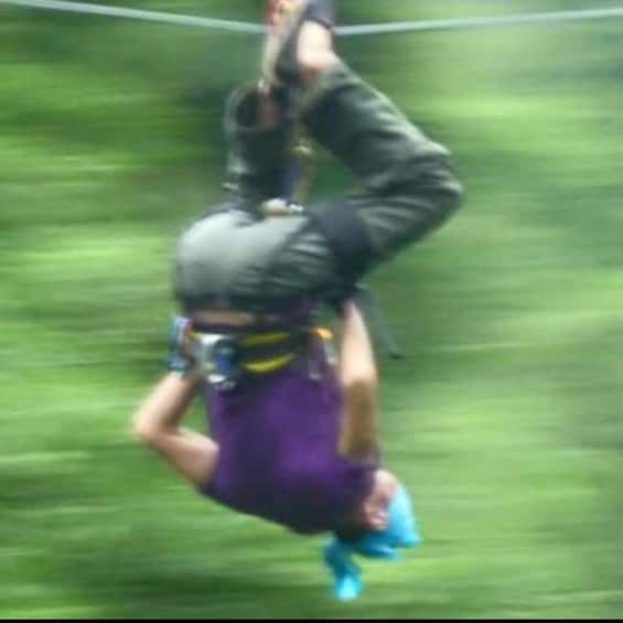 A person bungee jumping with a harness and helmet. 3