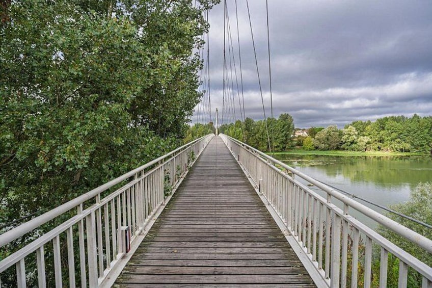 Bridge on the Garonne: A suspended walk offering a unique view of the river. 3