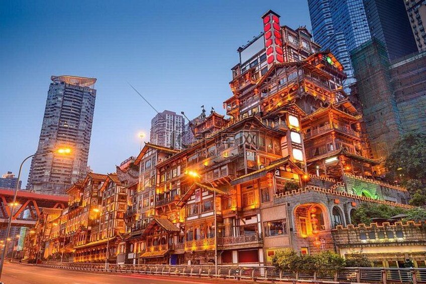 A multi-story building with traditional architectural elements, surrounded by modern skyscrapers. 1