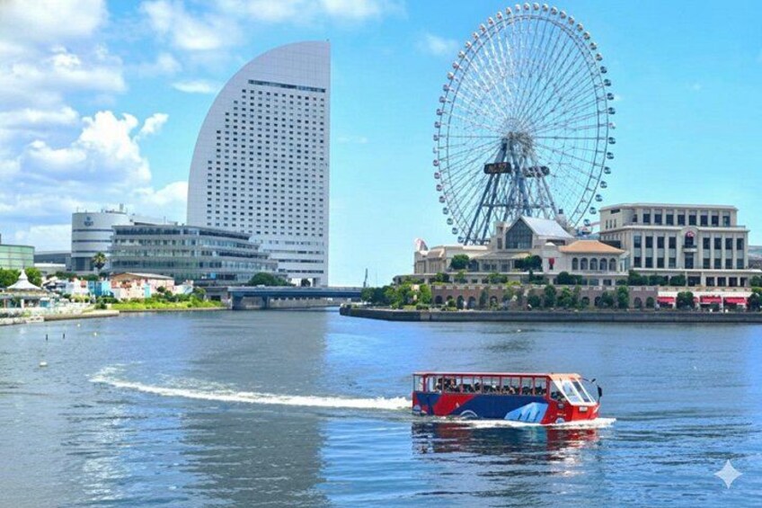 A boat on water, a large Ferris wheel, and modern buildings. 4
