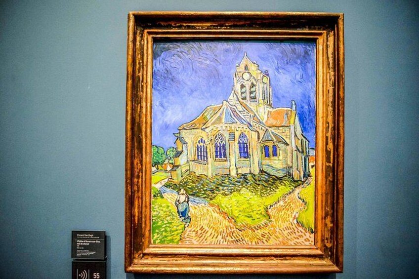 Et indrammet maleri af en kirke med en person foran. 3