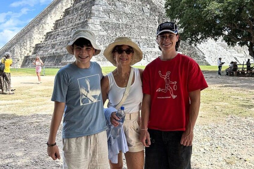A pyramid, a person in a red shirt, and a person in a blue shirt. 2