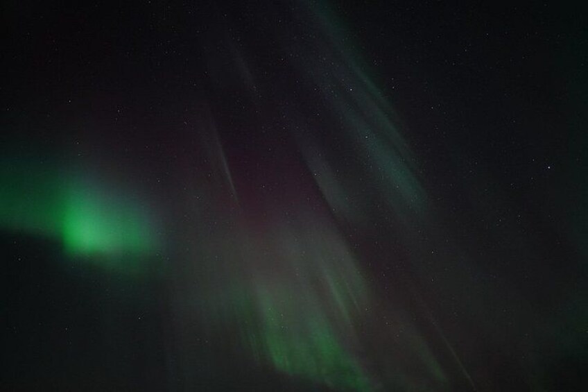 The aurora borealis with green and red hues. 3