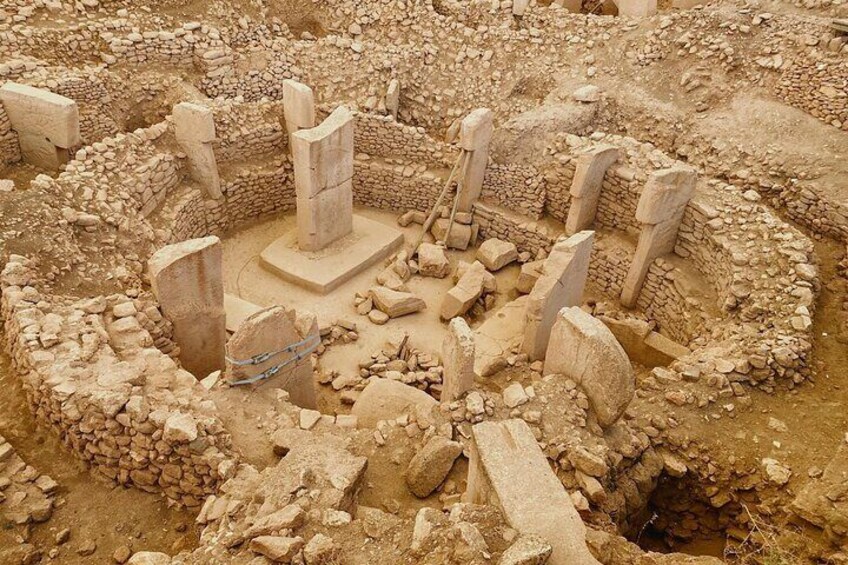 An archaeological site with stone structures and ruins. 1