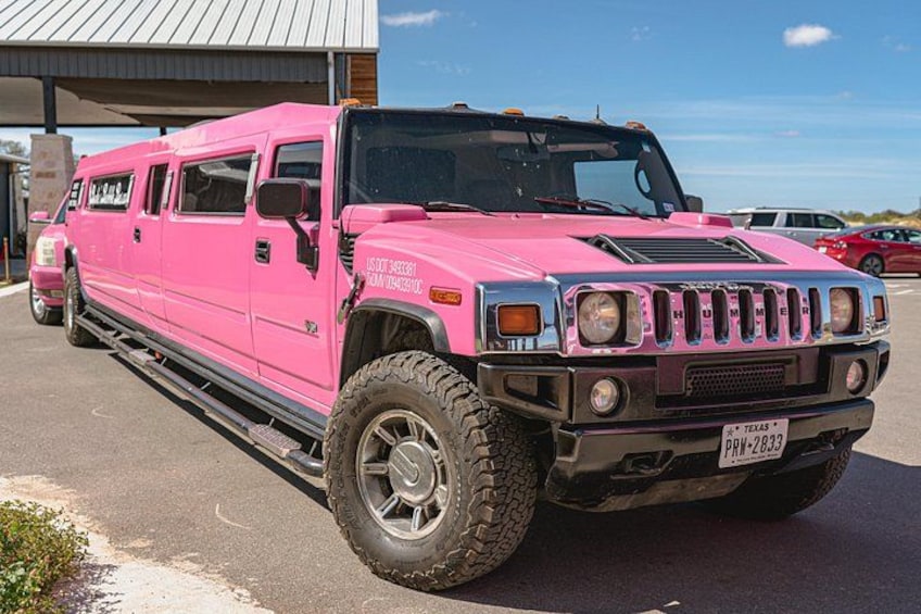 A pink Hummer H3 with Texas license plate PRW-2833 parked in a lot. 3
