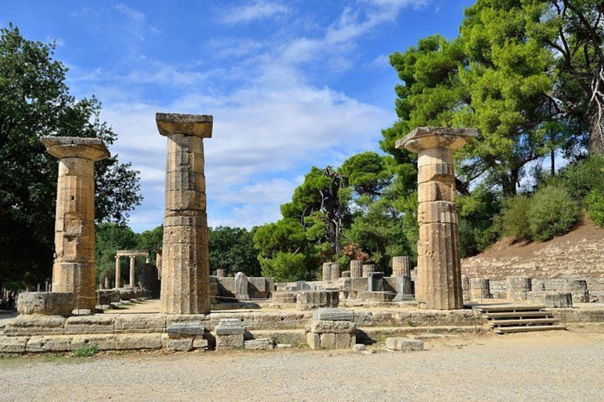 Ancient stone columns, ruins, and a clear sky. 3