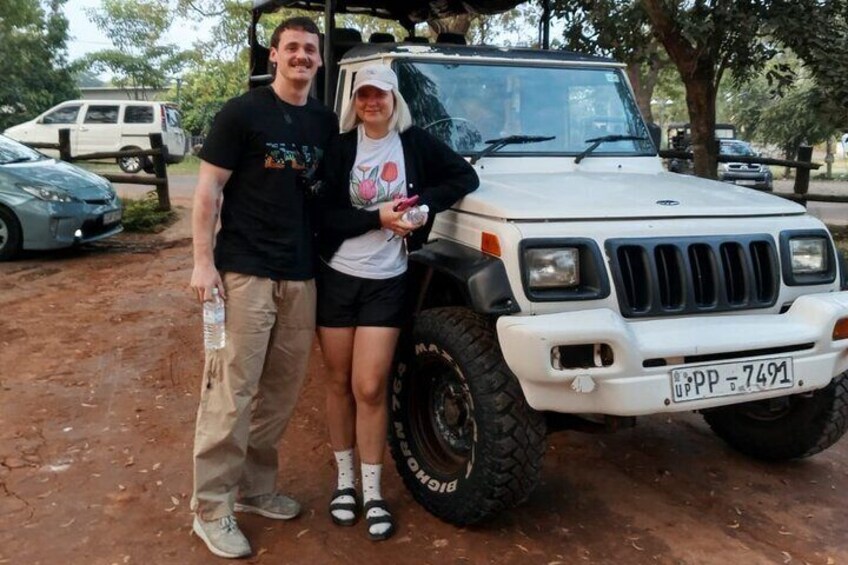A white off-road vehicle parked on a dirt surface with a license plate reading "UPP 7491". 1