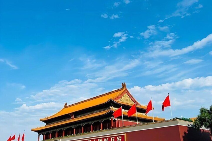 A traditional Chinese building with a golden roof and red flags. 3