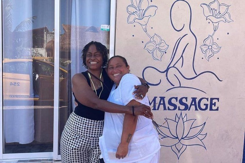 A massage parlor with a logo of a stylized figure and flowers. 5