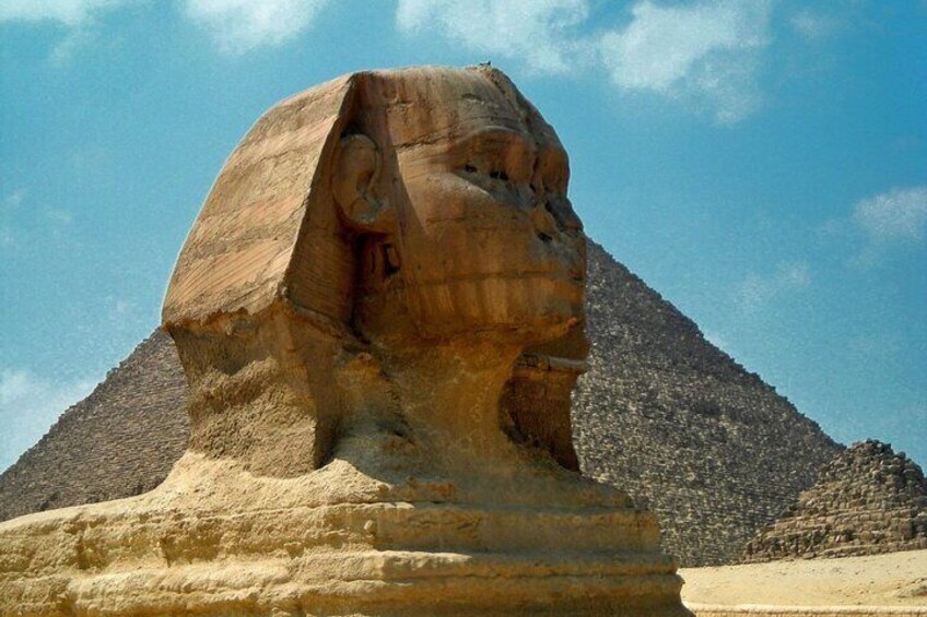 The Great Sphinx of Giza with the pyramids in the background. 5