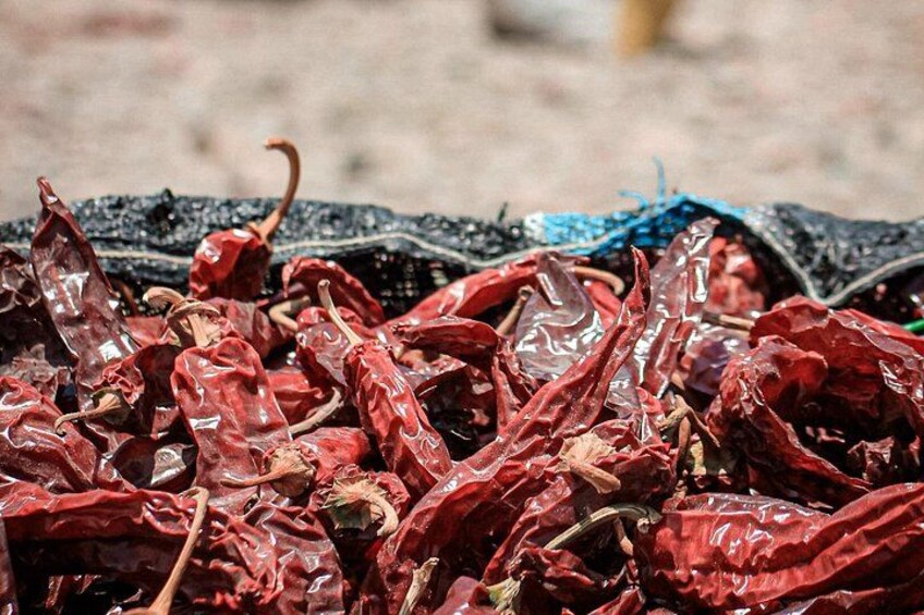 A pile of dried red chili peppers. 3