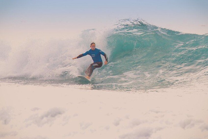 Powerful bottom turn on a clean West Coast wave. 4