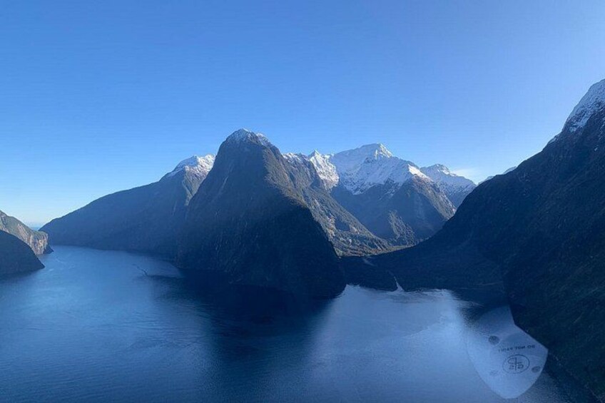 A mountainous landscape with a lake and snow-capped peaks. 2