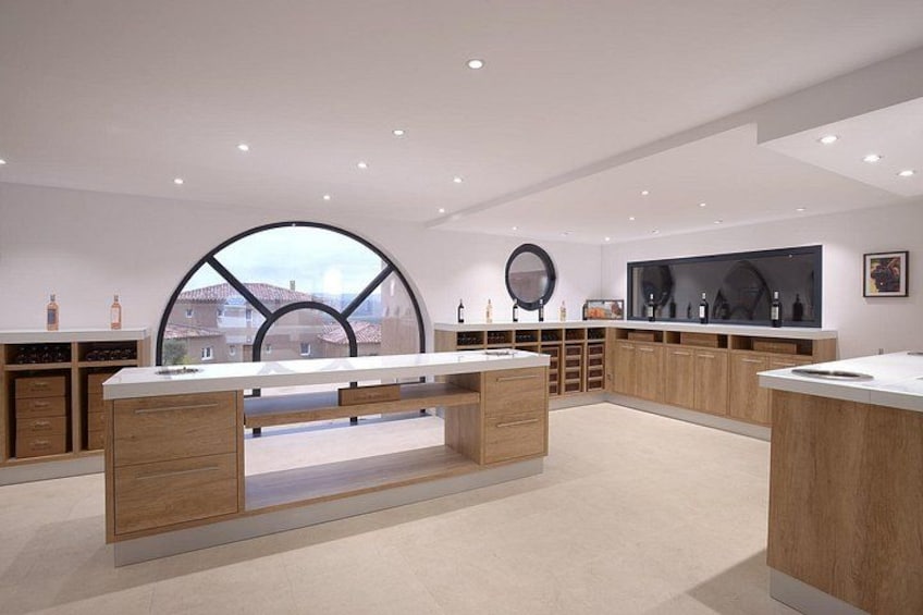 A modern kitchen with wooden cabinets, a central island, and a large window. 5