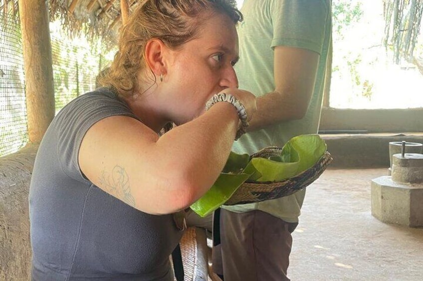A person holding a green leaf. 4