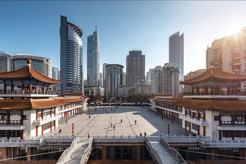 A traditional Chinese courtyard with modern skyscrapers in the background. 2