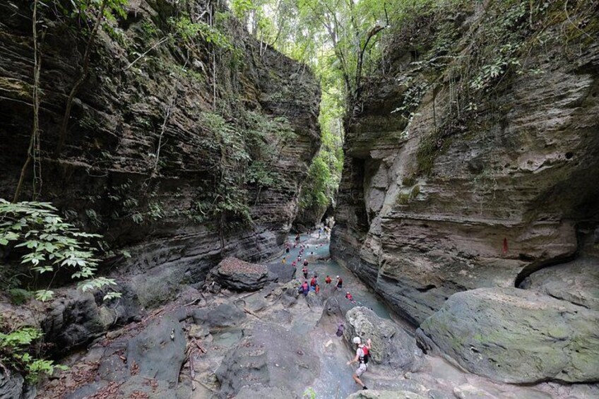 A canyon with hikers. 3