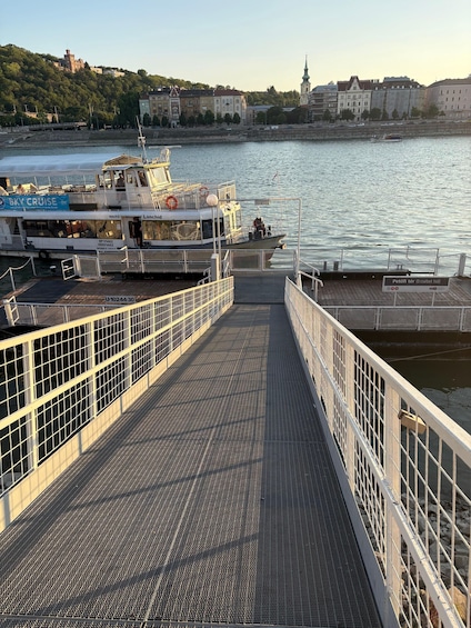 A ferry dock with a boat named 'Lanchid' and a sign indicating 'Petofi ter (Erzsebet hid)'. 3