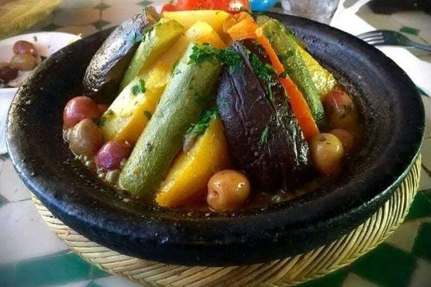 A dish of vegetables in a black bowl. 2