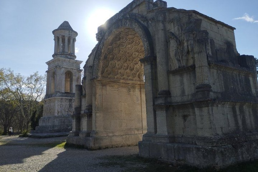 An ancient stone structure with intricate carvings and a bell tower. 3