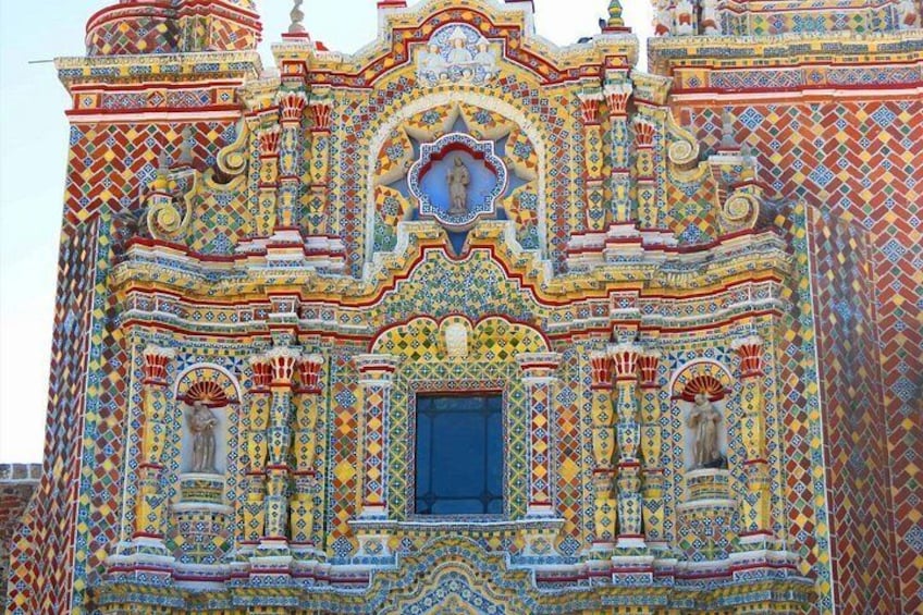 A colorful, intricately decorated building with detailed patterns and architectural elements. 4