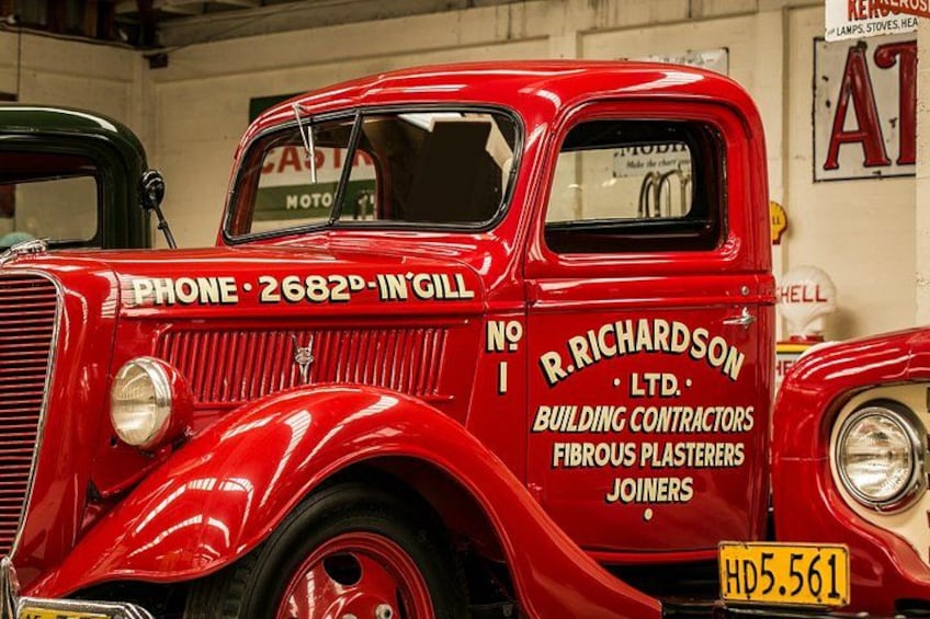 A vintage red truck with 'R. Richardson Ltd.' and 'Building Contractors' on the side. 3
