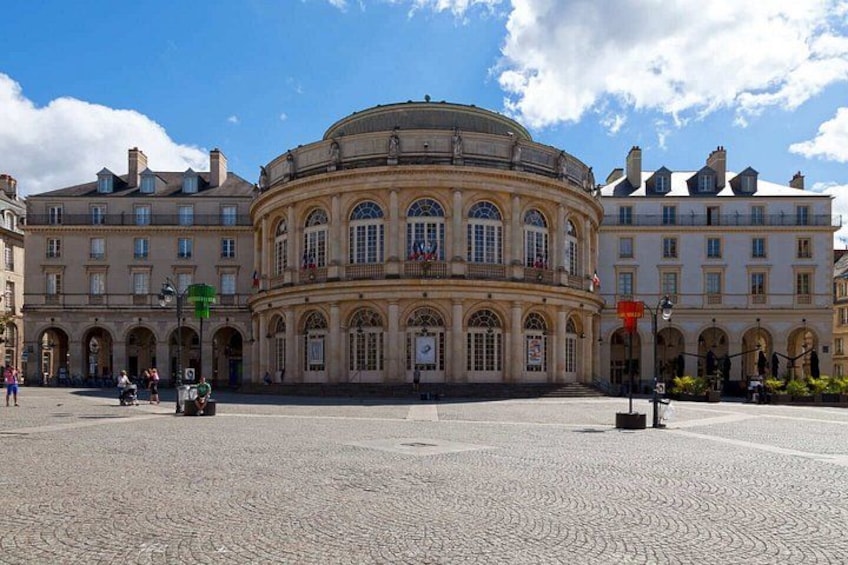 A historic building with a circular central section and arched windows. 3